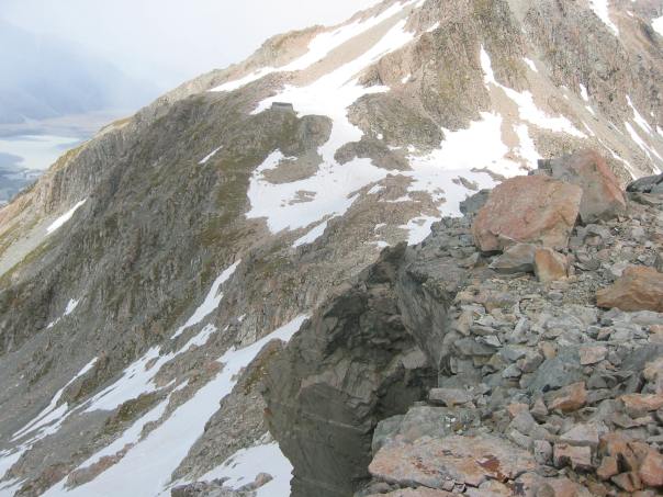 Caroline Hut - a private hut, blends in with the rock and can be hard to spot, Its centre left in this photo if you can see it.