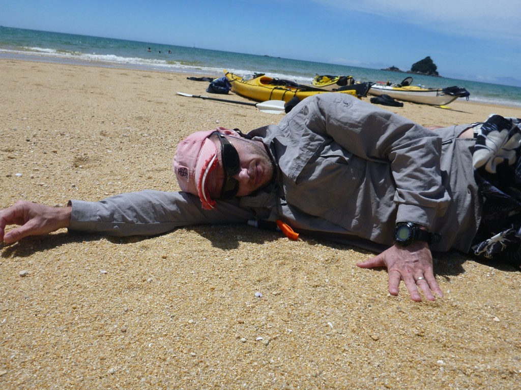 Having a snooze on the beach during a break.