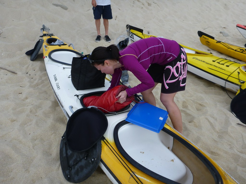 Stephanie packs our kayak in the morning.