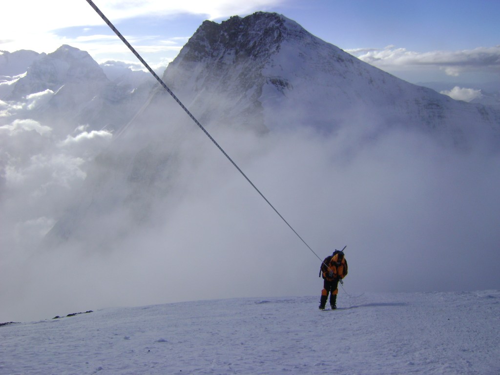 An exhausted Jim Morrow escaping the death zone in 2011 with frost bitten fingers after a failed summit attempt
