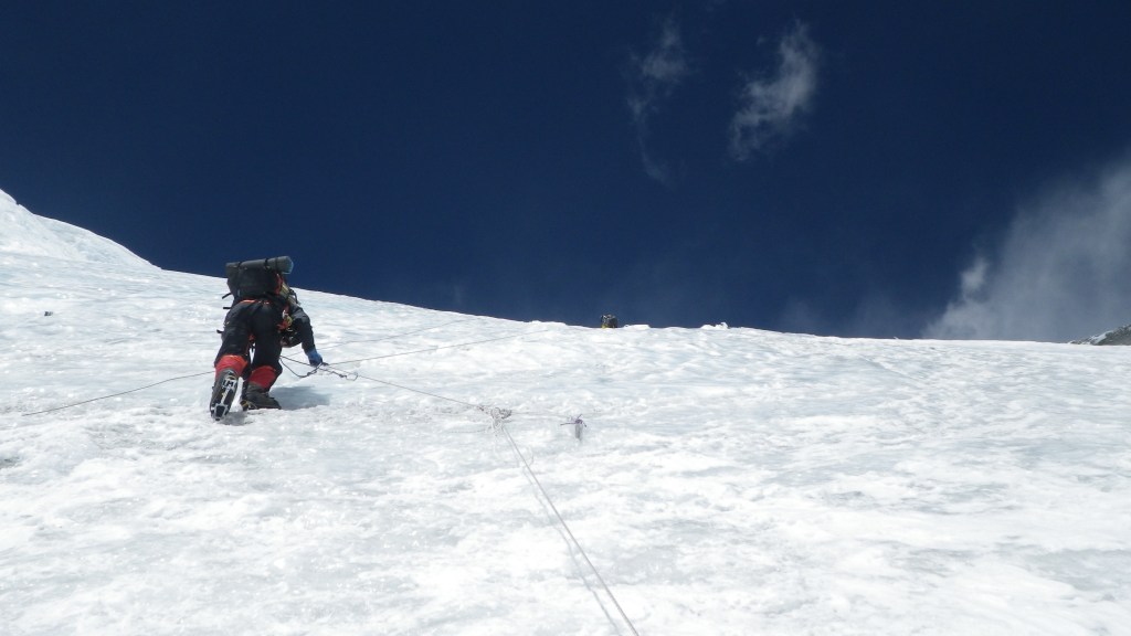 Climbing fixed ropes on the North Col at 6500m