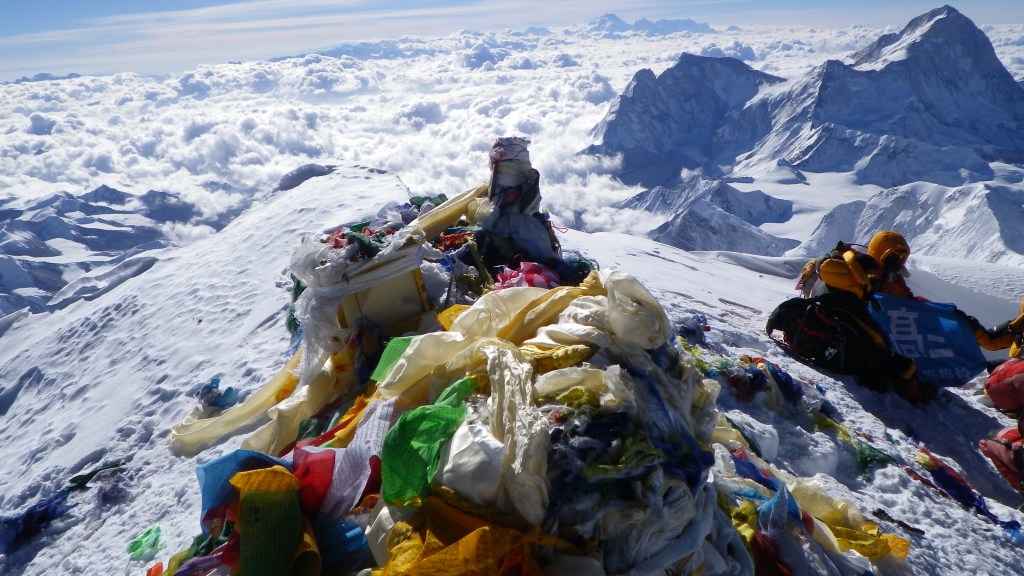 View from the summit - prayer flags are the colored scarves