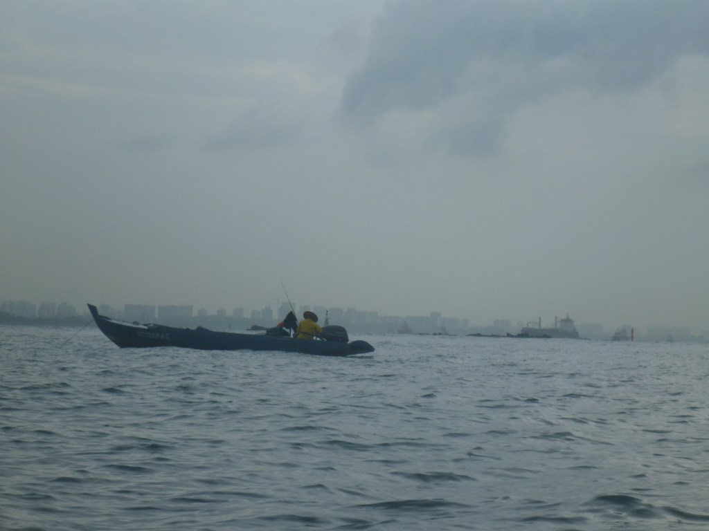 A fishing boat passes us.