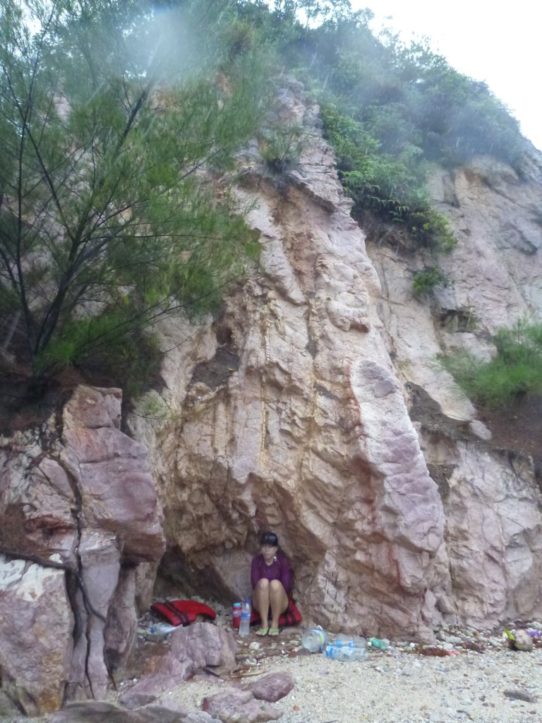 Stephanie finds shelter on Tekukor Island from the rain and lightning.
