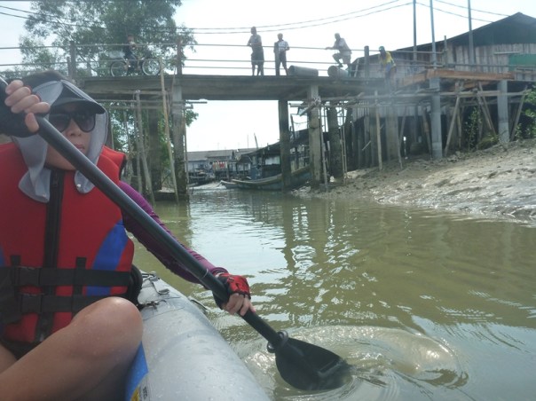 Stephanie paddling back up the river at low tide as we finish the paddle.