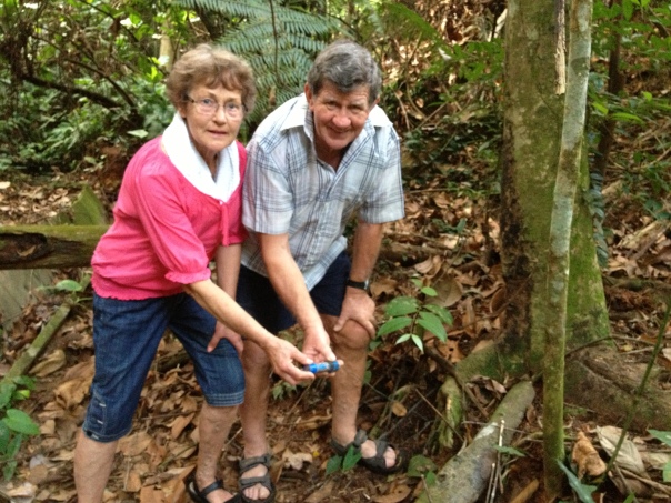 Success! Mum and Dad with their first geocache find.