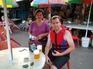Bevan enjoying a beer on Pulau Ubin with the friendly store owner