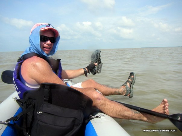 Paddling up the west coast of Malaysia towards Kukup fishing village.  The water was so shallow even though we 200m offshore.  I decided to jump out and sunk up to my knee's in very soft mud.