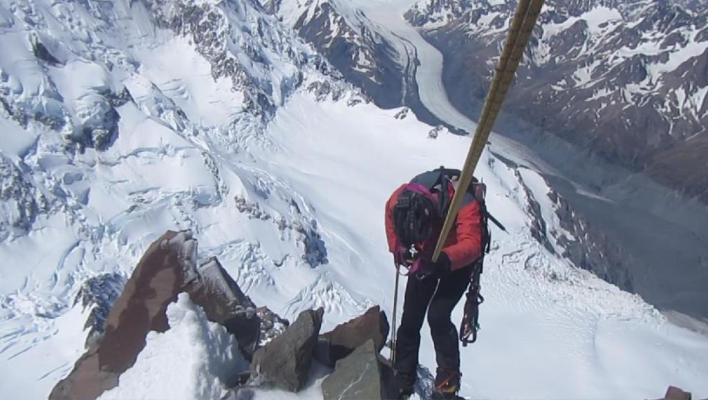 Alan Silva abseiling down the summit rocks of mt Cook.