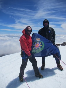 Axe and Robert Mills on the summit of Tahurangu with the NZ fire service flag.  The expedition donated NZ$1000 to the Toko and Stratford volunteer fire brigades on the summit.