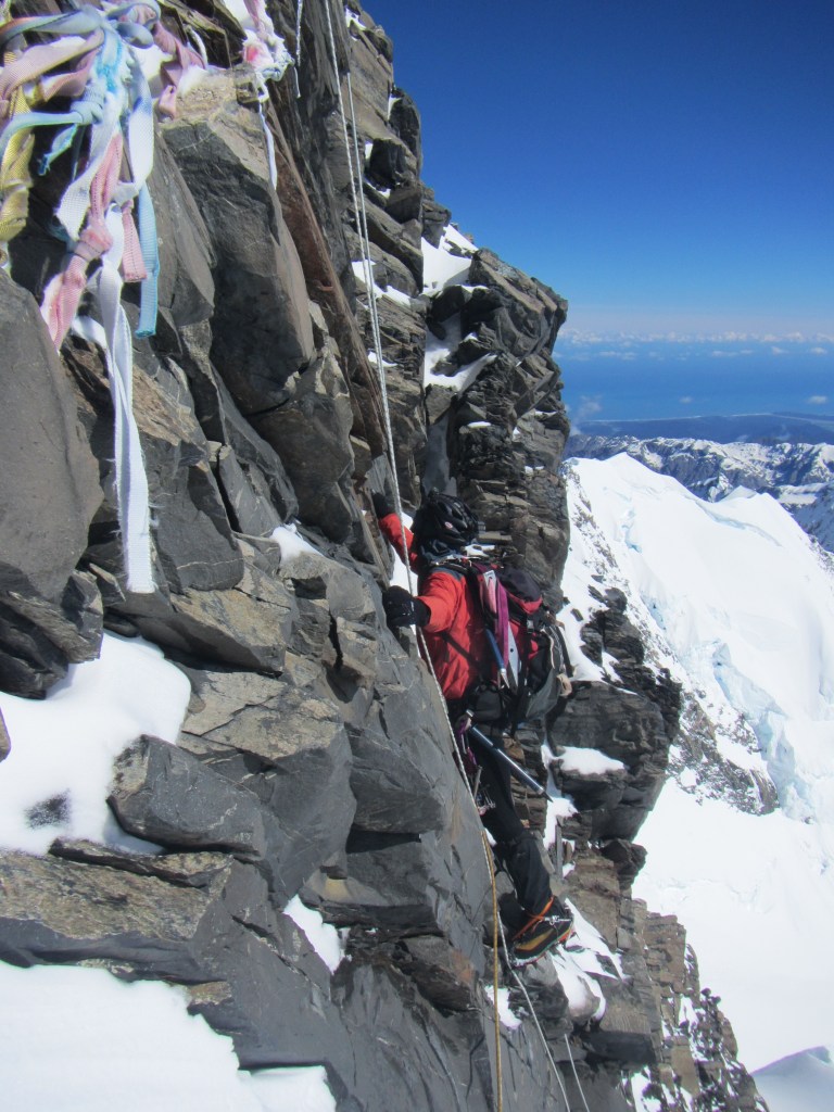 Alan Silva in his element climbing the summit rocks on Mt Cook.
