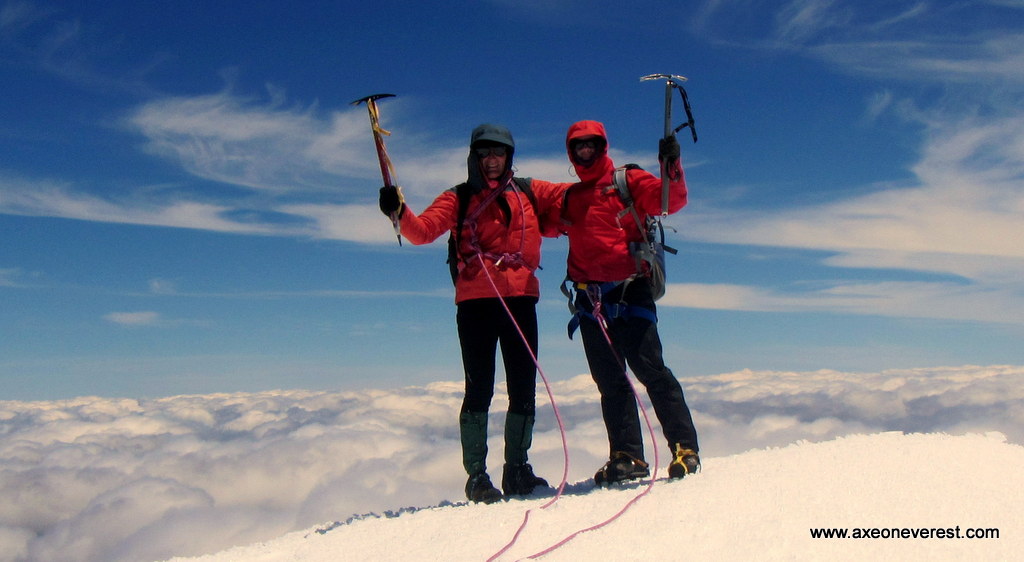 Grant Rawlinson, Jim Morrow and Robert Mills enjoy the view in the high winds from the summit of Tahurangi. Photo: Alan Silva