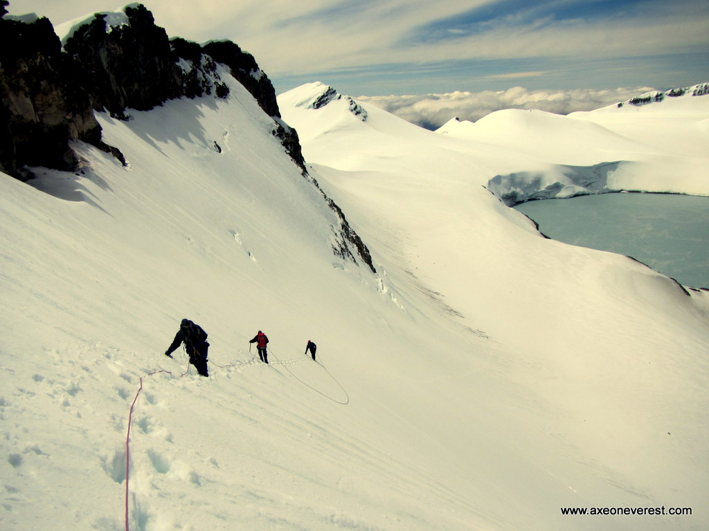 Alan Silva, Jim Morrow and Robert Mills descend the crater wall of Mt Ruapehu after reaching the summit.