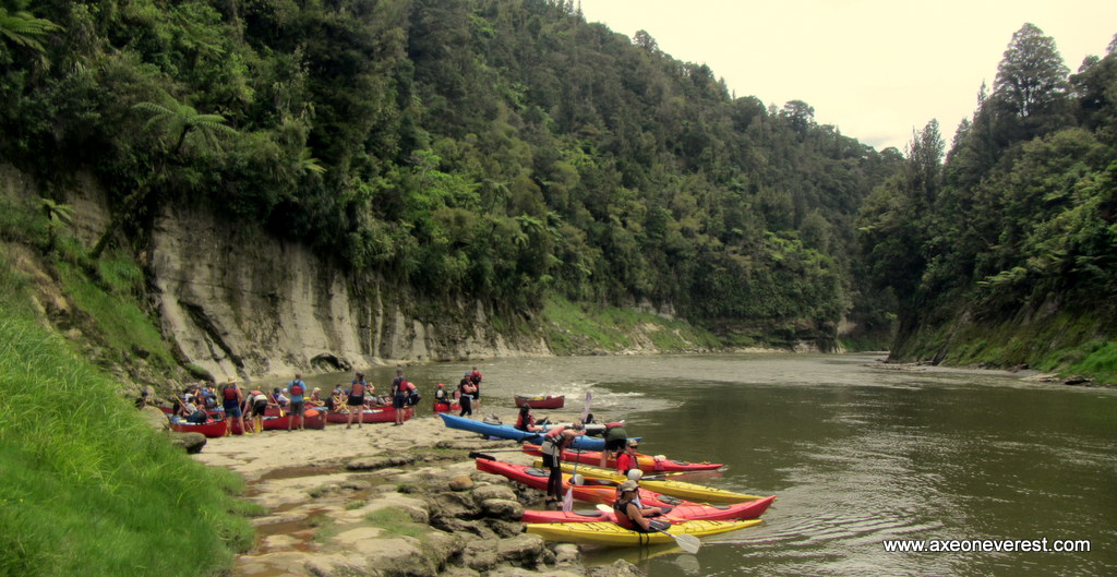 Kayakers on the banks of the Whanganui river.