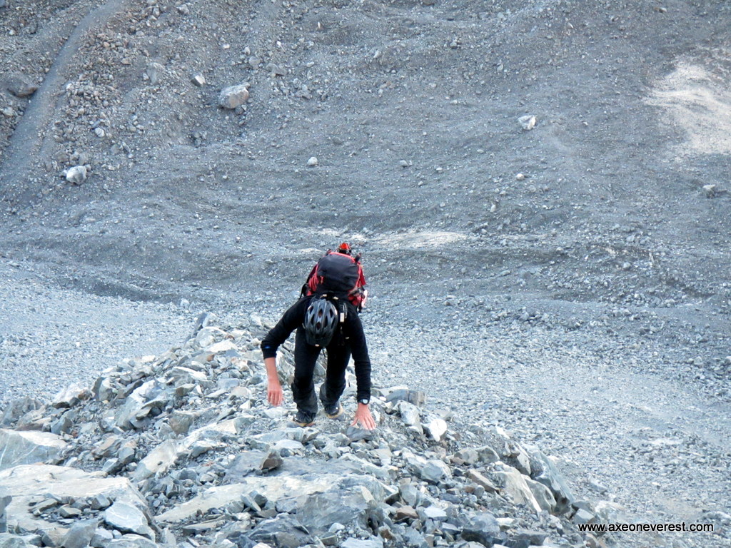 Alan Silva climbs steep moraine above the Tasman Glacier on the way to Cinerama Col.