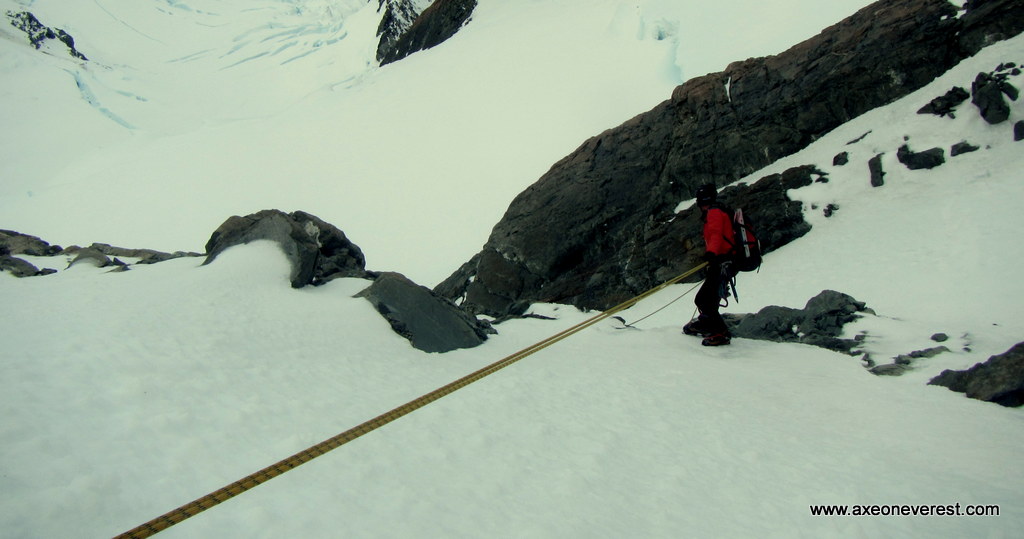 Alan Silva descending the summit rocks on Aoraki/ Mt Cook.