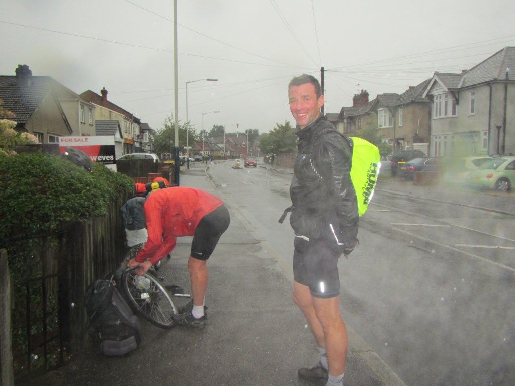Barclay getting cold as Alan fixes his puncture in the outskirts of London