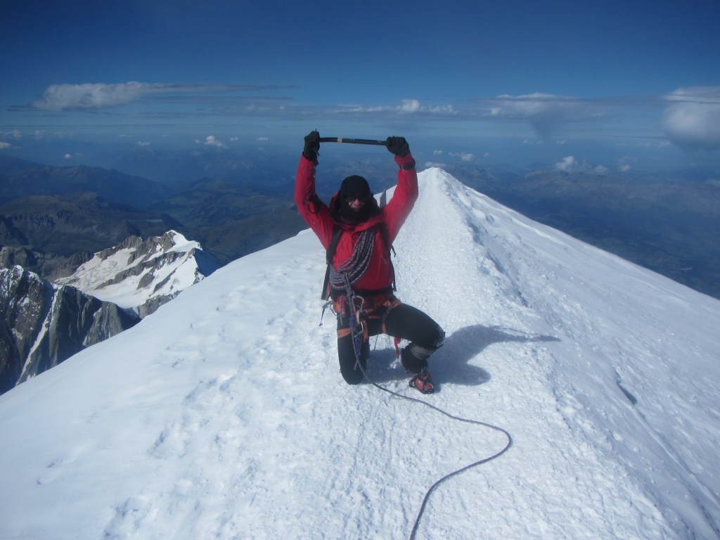 Yours truly very happy to be on top - and even happier that the wind died down as we sumited!