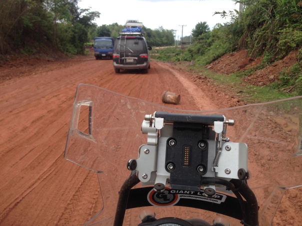 On the national highway in Laos, built by the same people who worked on the Cambodian national highway. 